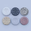 Round Woven Coasters In Various Colors With Textured Patterns On Light Blue Background 3d model