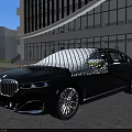 Black Mercedes SUV With White Protective Cover On Body Parked In Open Area