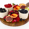 Assorted Fresh Fruits on Wooden Tray with White Bowls Raspberries Blueberries and Sliced Apricots