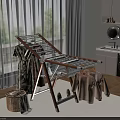 Foldable Wooden And Metal Clothes Drying Rack With Hanging Clothes In Bright Laundry Room