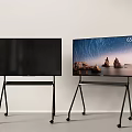 Two 65 Inch TVs on Black Rolling Stands Showcase Modern Display Setup