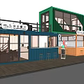 Modern Commercial Container Building with Multiple Containers Large Windows Balcony and Outdoor Seating