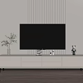 Modern White TV Stand With TV Vase And Decorative Items On Vertical Striped Wall