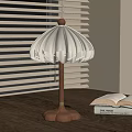 Wooden Table Lamp With White Pleated Shade On Wooden Desk By Window With Blinds
