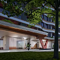 Modern High Rise Building Entrance With Red V Shape Accent Green Plants And Stone Pathway
