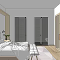 Hotel Guest Room With Two Double Beds Bedside Tables Lamps Framed Pictures Bench And Rug