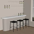 White Bar Counter With Black Stools Wine Bottles And Glasses On Shelf