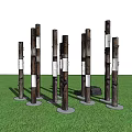 Outdoor Pillar Lights With Natural Wood Design Illuminating Green Lawn At Dusk