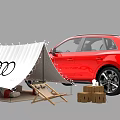 Audi Red SUV With Open Trunk And Camping Gear Including Tent Chairs Firewood