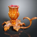 Golden Carved Decorative Candle Holder With Leaf Shaped Base And Curved Handle