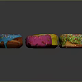 Vibrant Colorful Donuts With Dripping Frosting And Sprinkles On Black Surface