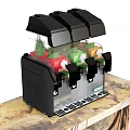 Black Beverage Dispenser With Red Green Orange Drinks On Wooden Countertop