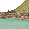 Scenic Waterfront Area With Traditional Wooden Buildings And Covered Boats Near Mountains