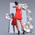 Full Length Mirror With Woman In Red Dress And Silver Flower Decorations Near Display Shelf