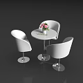 Modern Tea Break Area With Round White Table Pink White Flowers And Three Curved Chairs