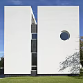 Modern Detached House With White Exterior Geometric Design Circular Window Front Steps And Lawn