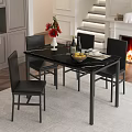 Black Dining Table Set With Marble Top Black Chairs Red Flowers Wine Glasses By Fireplace