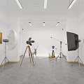 Modern Photography Studio With Studio Lights Tripods Paintings On Walls Gray Floor And Small Decor