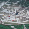 Aerial View Of Industrial Drilling Site With Circular Layout Towers Vehicles Buildings And Roads