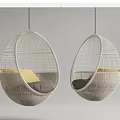 White Wicker Egg Hanging Chairs with Yellow and Grey Cushions