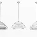 Three Modern Pendant Lights with Different Colored Dome Shades and Metallic Accents Hanging from Ceiling