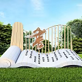 Open Book Sculpture With Scroll And Chinese Characters On Pages In Green Grass And Trees