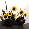 Black Vases with Sunflowers and Dried Grass on Gray Countertop White Wall