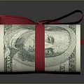 Rolled US Dollar Bills Tied With Red Ribbon On Dark Surface