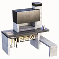Stone Outdoor Cooking Station With Black Countertop Firewood And Cooking Utensils