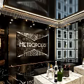 Elegant KTV Lounge Interior With Black Decorative Wall Marble Countertops And Wine Bottles