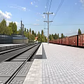 Railway Platform And Track Infrastructure With Electric Poles Trees And Red Train Cars