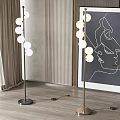 Modern Floor Lamps With Spherical Bulbs In Living Interior With Abstract Art And Green Plant