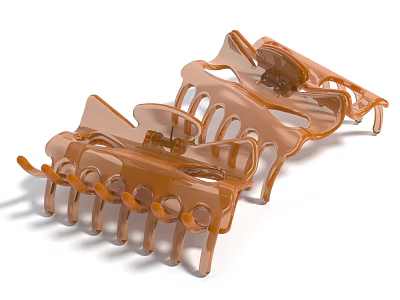 Two Orange Plastic Hair Clips With Multiple Teeth And Curved Structure For Daily Use 3d model