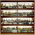 Liquor Cabinet Stocked with Various Wine and Whiskey Bottles on Organized Wooden Shelves