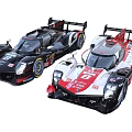 Two Black And White Racing Cars With Aerodynamic Design And Number Decals