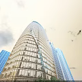 Tall Modern Office Building With Curved Glass Facade And Blue Sky Surroundings