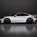 White Porsche Sports Car With Sleek Design Black Wheels And Sporty Styling