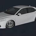 White Toyota Sedan With Modified Alloy Wheels And Sporty Exterior Look
