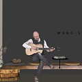 Man Playing Acoustic Guitar With Cat In Stylish Interior By WANG SHEJI