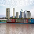 Container Ship With Colorful Containers Sailing On River Near City Skyline