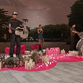 Outdoor Music Performance With Guitar Singer Drums Love Sign Heart Decorations Candles And Flowers