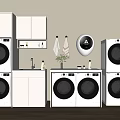 Modern Stacked Washing Machines In Laundry Room With White Cabinets And Towels