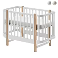 Modern Baby Crib With White Frame And Natural Wooden Elements