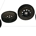 Four Worn Automotive Tires With Metal Rims Arranged On White Background