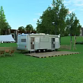 Silver Camper Van On Wooden Platform In Green Grassland With Trees Tent And Outdoor Chairs