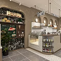 Modern Coffee Shop Interior With Pastry Display Counter And Green Plants
