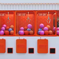 Orange Claw Machine With Colorful Balls Mechanical Claw And Digital Time