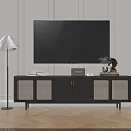 Modern Black TV Stand with Woven Doors Books Clock Vase Decorative Item and Floor Lamp
