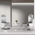 Modern Metallic Table And Chair Set With Sleek Lines And Small Potted Plant