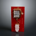 Red Decorative Item With Transparent Panel And White Label Design